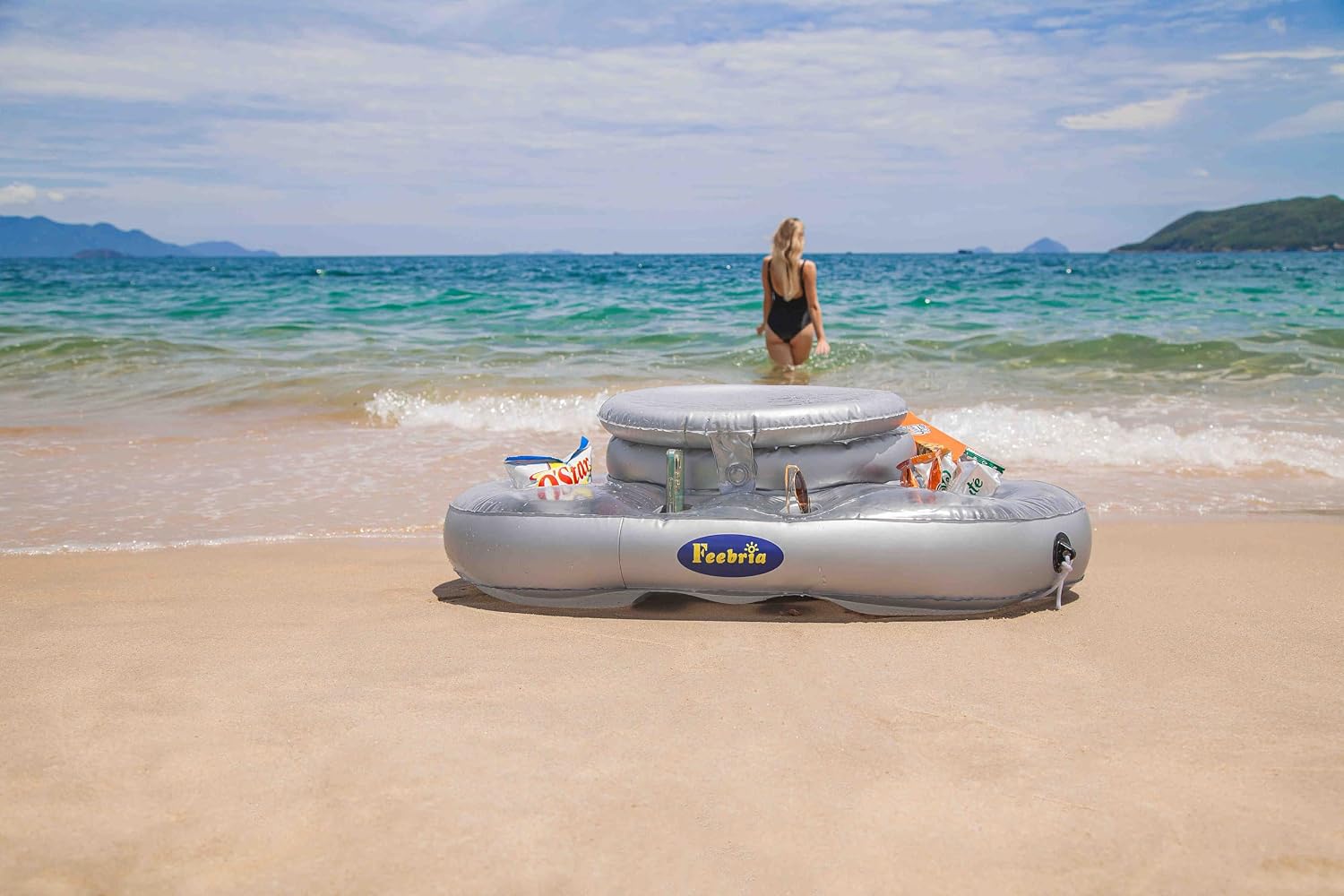 FEEBRIA floating cooler on a sunny beach